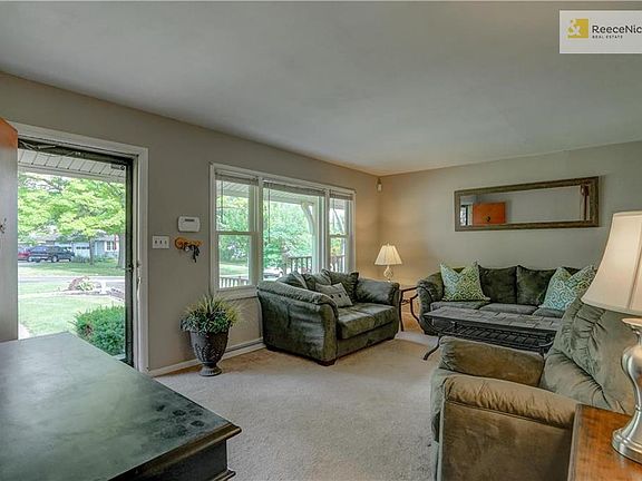 Living room drenched with natural light! Newer windows throughout!