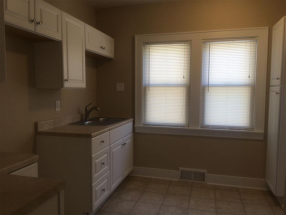 updated kitchen w new floors/cabinets/counters