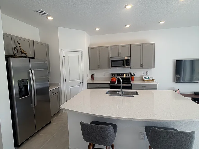 Kitchen. Spacious pantry closet. Stainless steel appliances. Recessed lighting throughout.