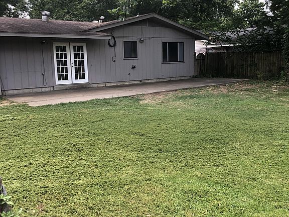 Large back yard fully fenced with a nice patio and large shade trees.