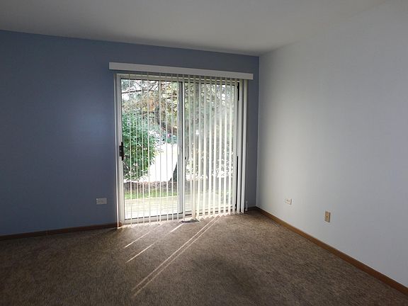 Bright living room with patio access.