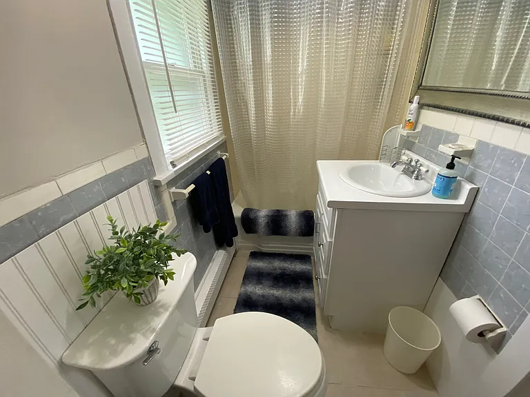 small bathroom with corner closet