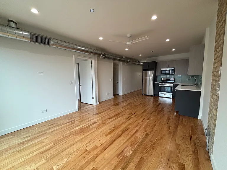 Open living space with exposed ducting and a little exposed brick too!