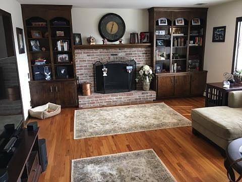 Living room with brick fireplace