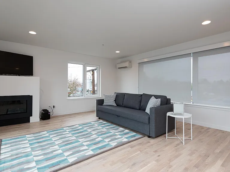 Fourth floor Family Room (or 5th Bedroom) with fireplace, balcony and wet-bar