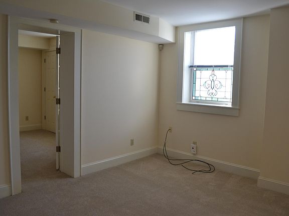 Living area with stained glass window.