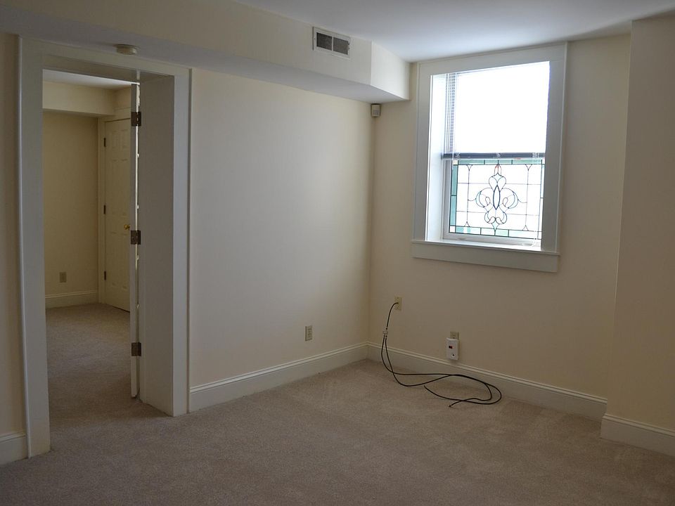 Living area with stained glass window.