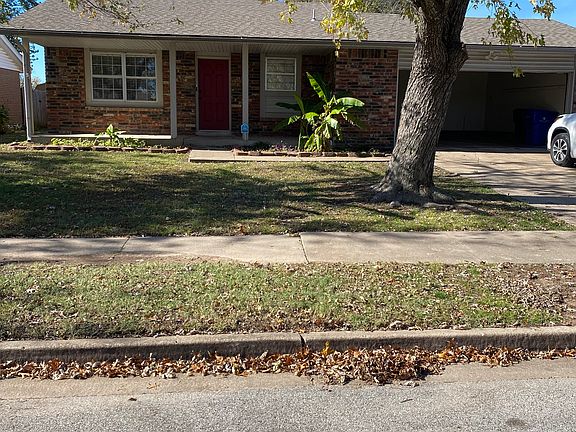 nice big tree and flower beds