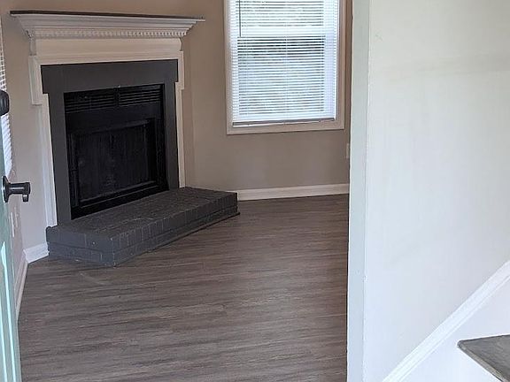 Walking in you are greeted by a log burning fireplace