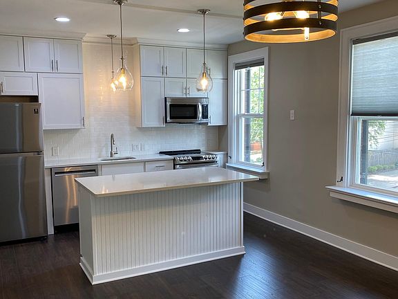 Island with space for stools and dining area for table and chairs