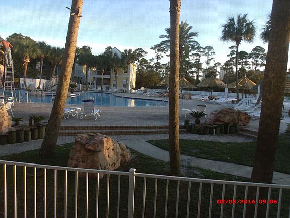 screened in porch overlooking pool