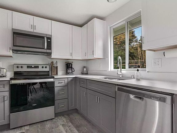 Brand new kitchen with stainless steel appliances