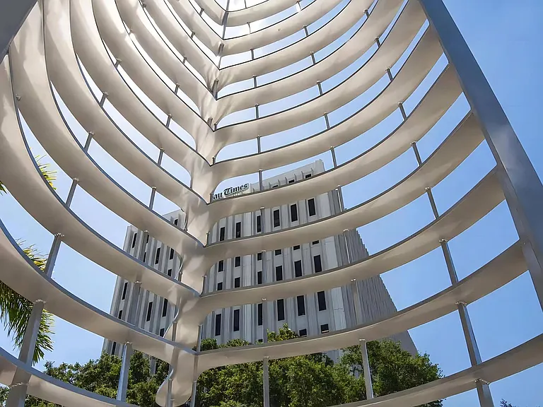 Artistic Metal Sculpture Outside Anchor Riverwalk with View of Downtown Landmark