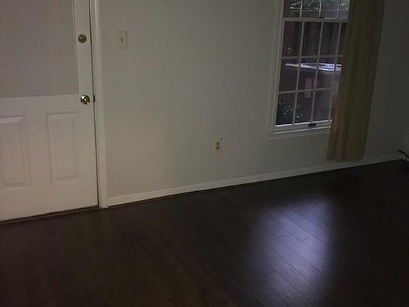 Rec room in basement with exit to backyard and lower deck