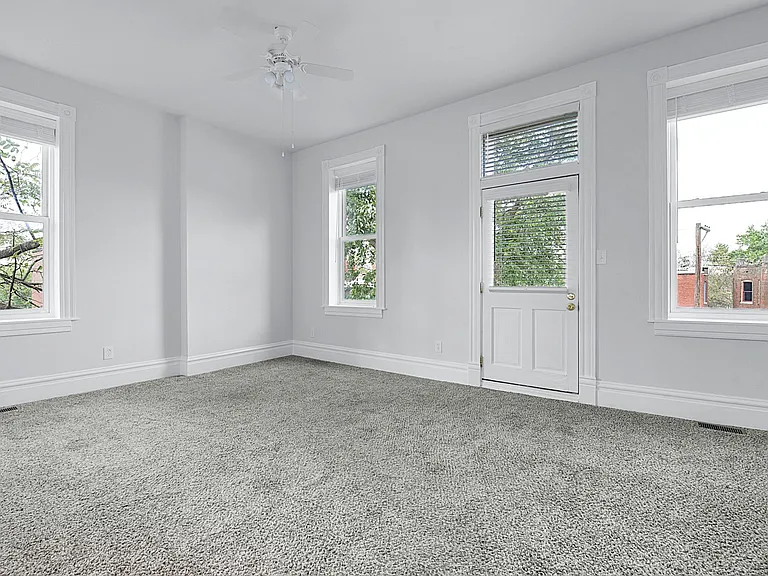 The Primary Bedroom - Level 2: 10' ceilings, ceiling fan, balcony outside