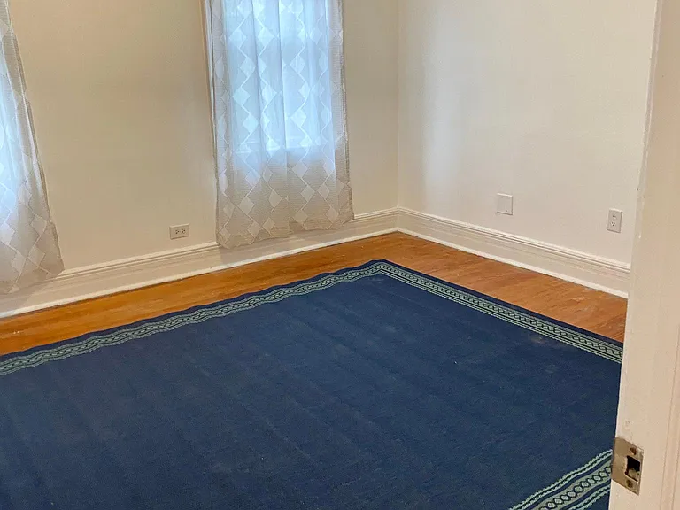 Living room has three windows for lots of light
