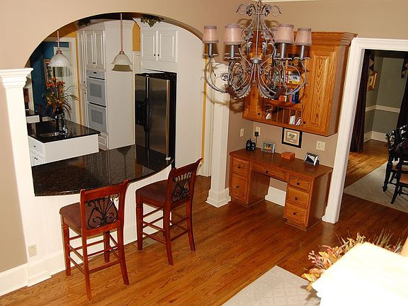 Open Floor Plan With Rich Hardwood Flooring on Main Level