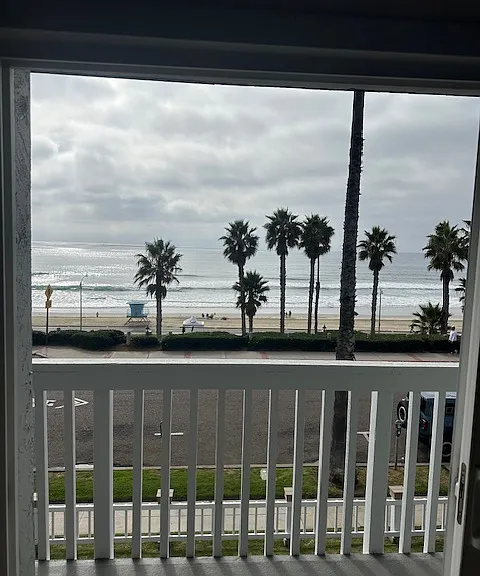 Balcony and view. Cross the street and your at the beach!