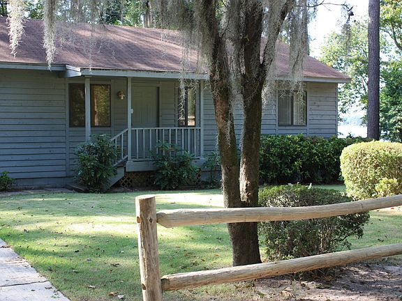View of porch and entry way from large parking area.