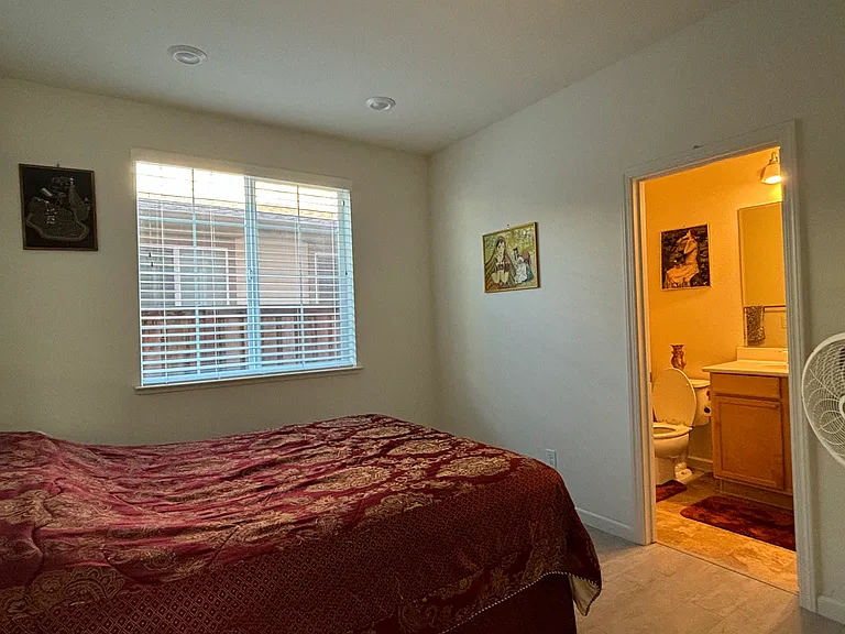 Downstairs Bedroom with attached full bath and walk in closet