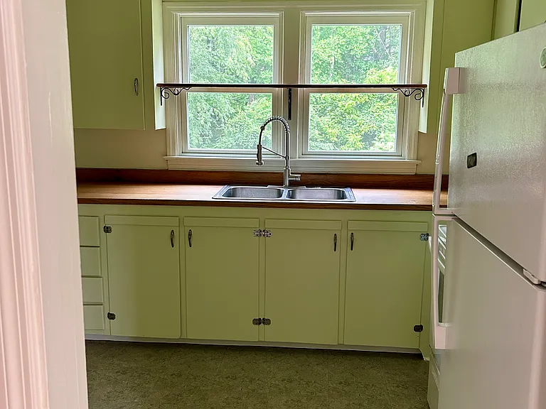 Kitchen with newly oiled wood countertops. Cabinets just stripped and painted.
