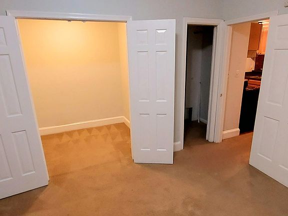 Bedroom with work area / nursery / studio annex, and walk-in closet.