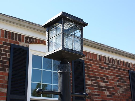 Solar Coach Light, no light bulbs to change. Comes on even when your not home.