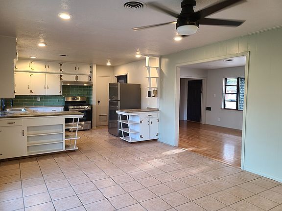 Dining area looking into the kitchen and front living room