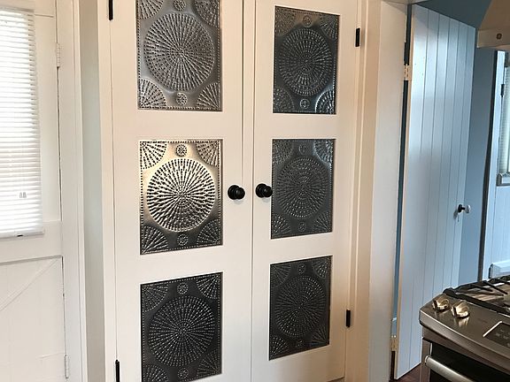 Tin Punched cabinet in kitchen