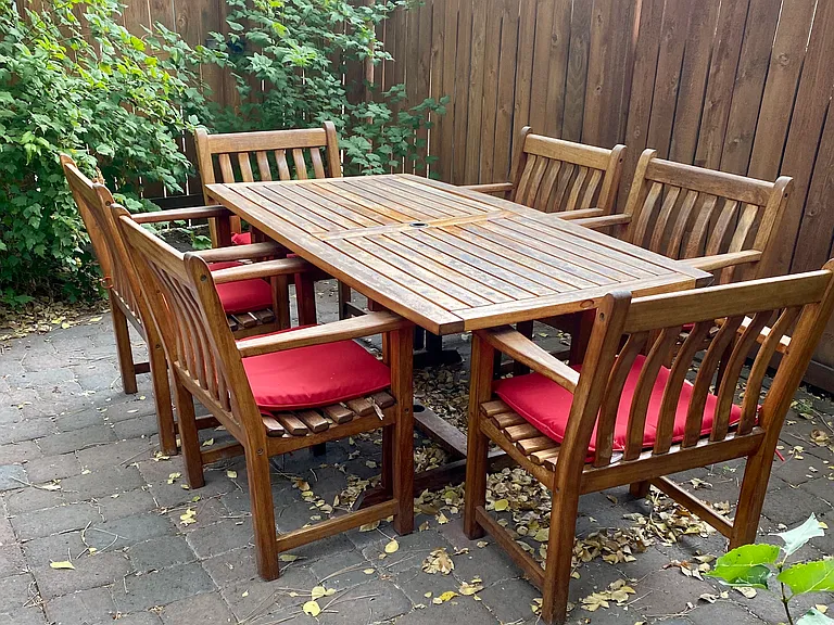Backyard patio has space for a grill and outdoor living / dining