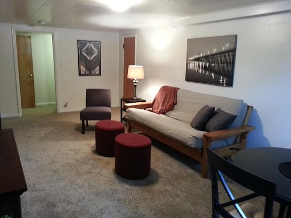 Living room with door to hallway