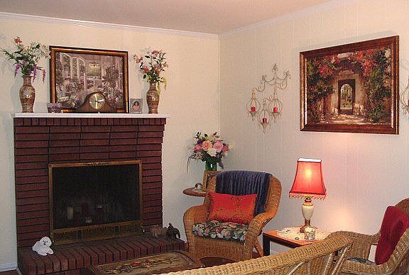 This is aview of the great room with a masonary fireplace