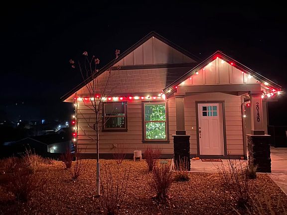 Front of house is xeroscaped with sprinklers. Low maintenance