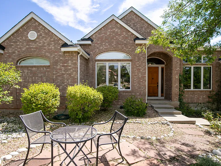 Beautiful brick home tucked in Eagle Canyon and backing to neighborhood open space.