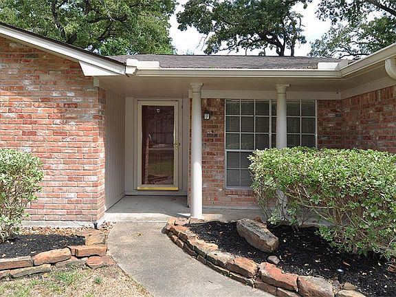 Covered front porch adds charm to this ranch style home.