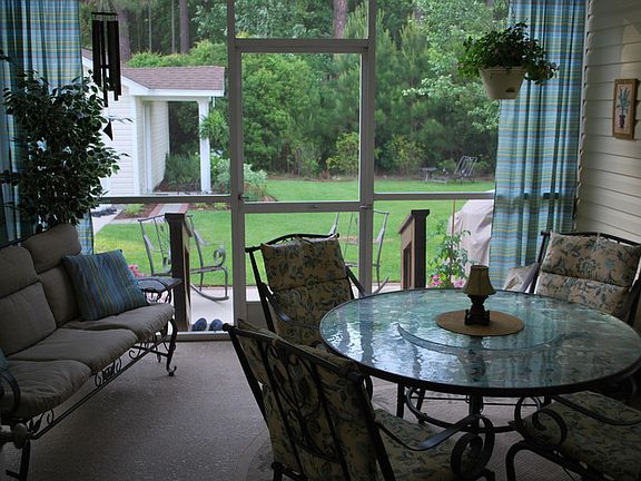 VIEW FROM KITCHEN TO PORCH
						:
						BACK SCREENED PORCH - ANOTHER VIEW, EXTENDED OUTDOOR ROOM
