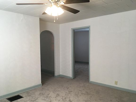 Dining Room into Living Room & Front Bedroom.  New light fix