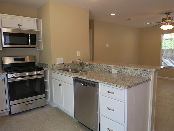 Kitchen looking into living room