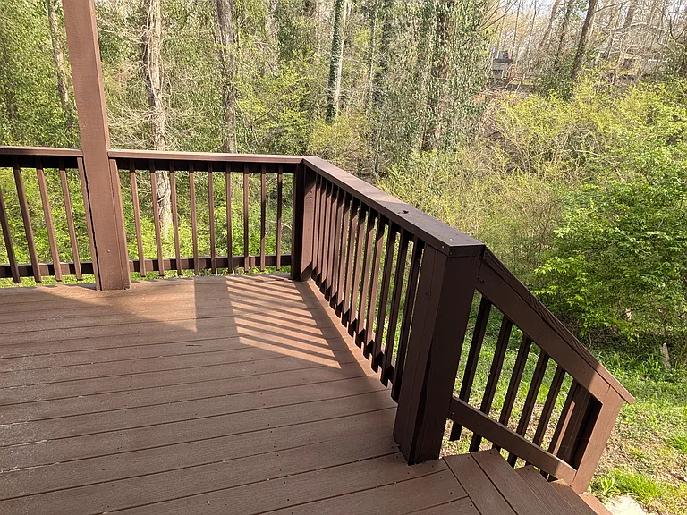 Lower level deck with stairs to side yard