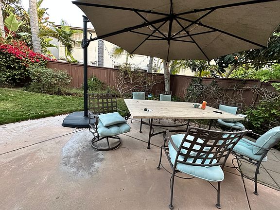 Backyard: Private backyard with outdoor dining