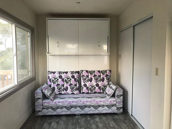 Murphy Bed can retract to make way for a couch that is included.