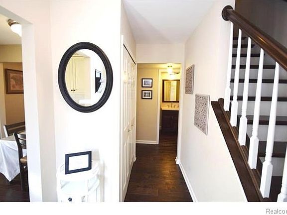 Foyer with wood floor, new base moulding