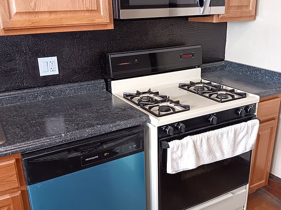 Gas Stove, Microwave, Dishwasher, Refrigerator (not shown)