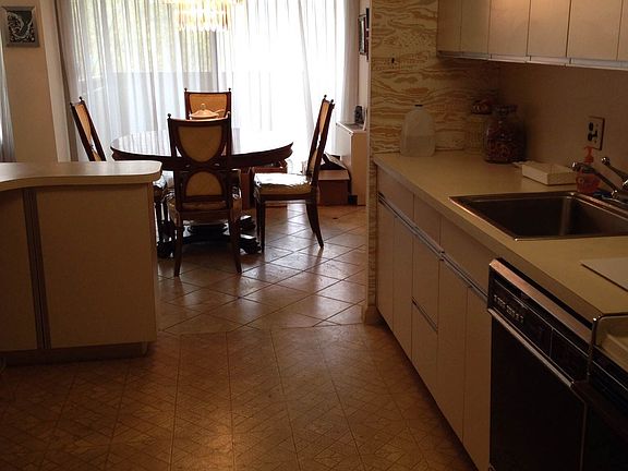 Kitchen leads to dining room