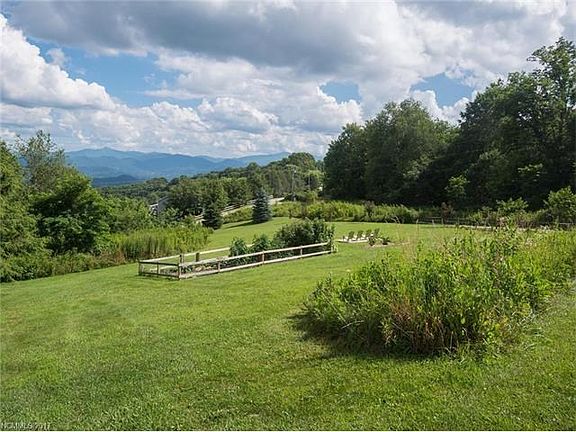 Top of the mountain views that are seen from every spot in the yard. A garden that has been planted and cared for. A yard that is enjoyed by all.