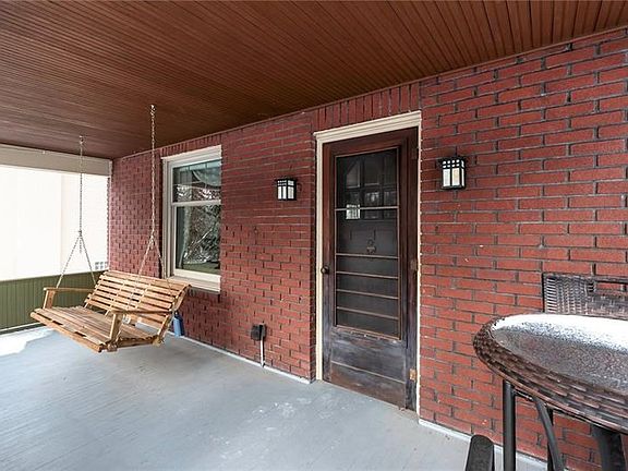 Enjoy Your Evening Glass on Wine on the Front Porch Swing!