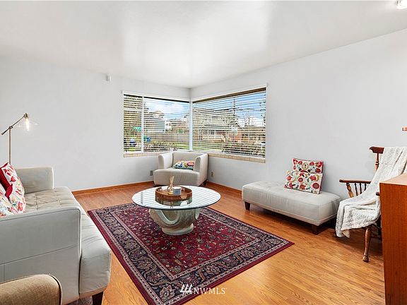 Spacious living room is light and bright.