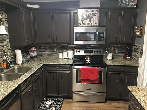 Kitchen with granite countertops and stainless appliances