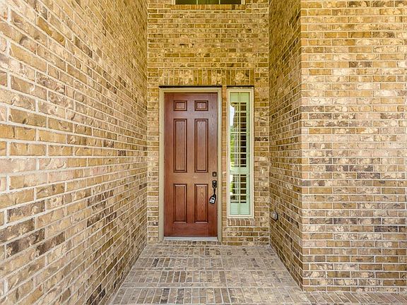 Wonderful two story brick entry, with a large porch, invites you in to this beautiful home.