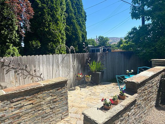 Custom patio and easy access to community side yard